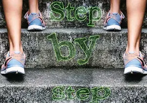 the lower legs of people climbing steps