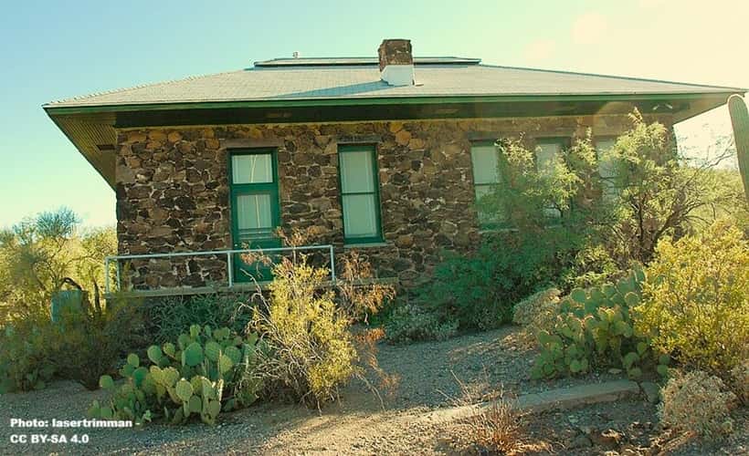 stone building on a desert hillside in Tucson Arizona