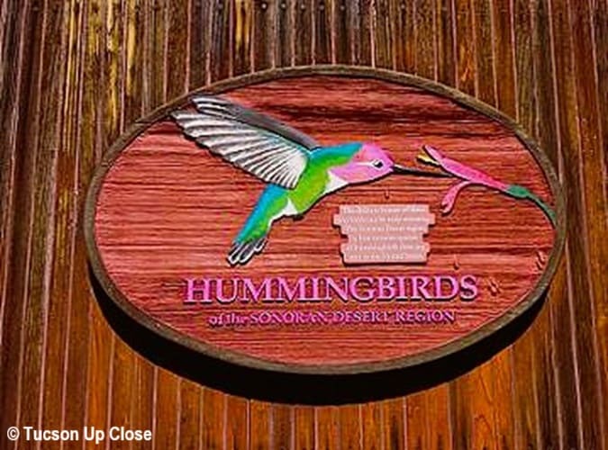 Sign on entry building to access a hummingbird enclosure
