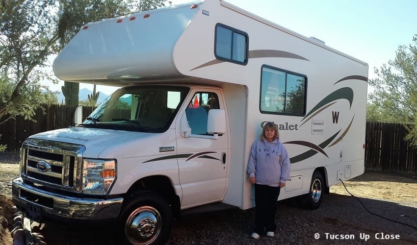 woman standing in front of a motor home RV