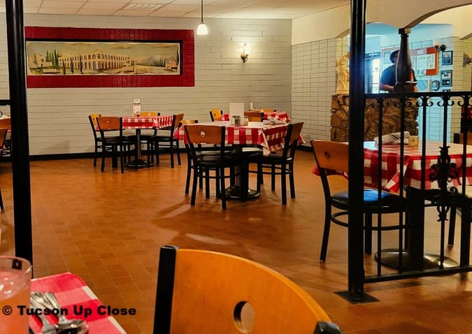 restaurant with checkered tablecloths and chair seating