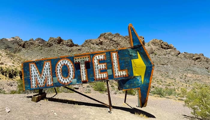 motel sign pointing the way down the road motel sign pointing the way down the road