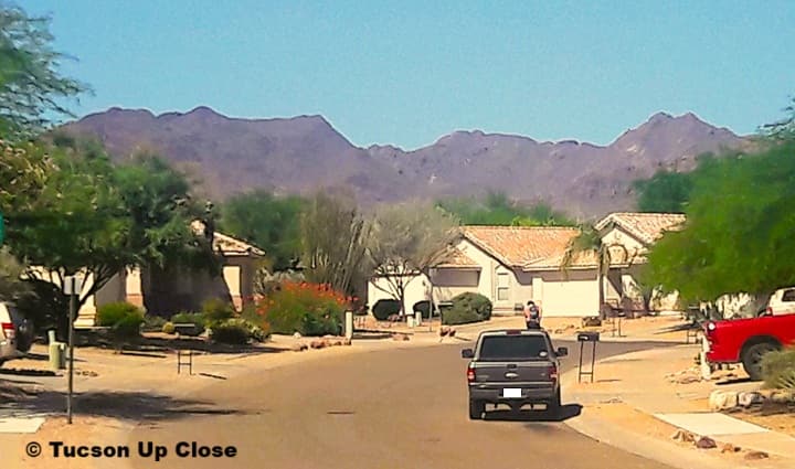 a street in a neighborhood with Spanish styled homes