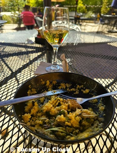 meal with wine on a metal table outdoors