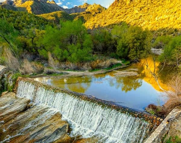 water spilling over a built waterfall in Sabino Canyon Tucson