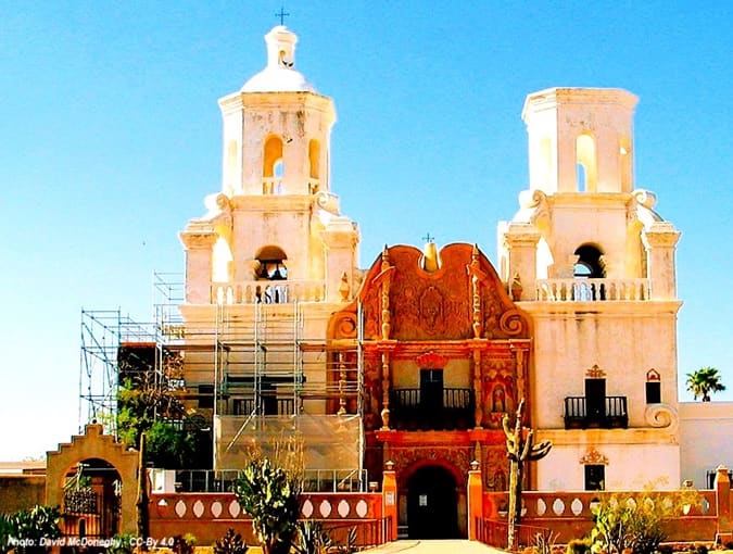 Mission church with scaffolding around the side to the front to manage repairs