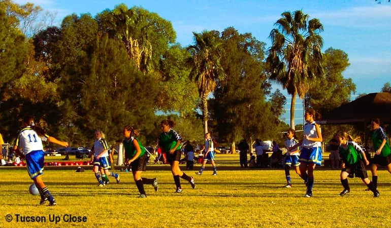 Girls soccer teams playing in a Tucson Public Park