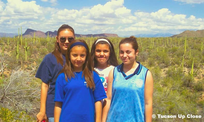 four teenagers at a viewpoint in Saguaro National Park West